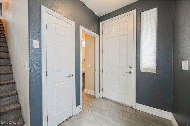 entrance foyer with light hardwood / wood-style flooring