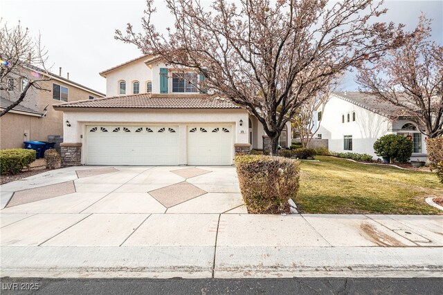 view of front of house with a garage and a front yard