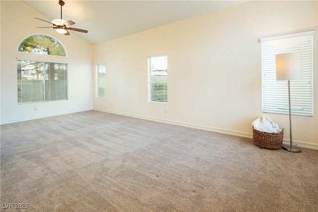 unfurnished room featuring ceiling fan, light colored carpet, and high vaulted ceiling