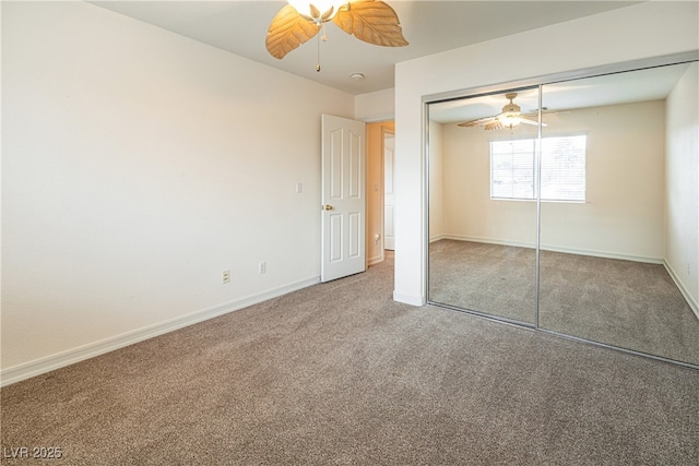 unfurnished bedroom featuring carpet, ceiling fan, and a closet