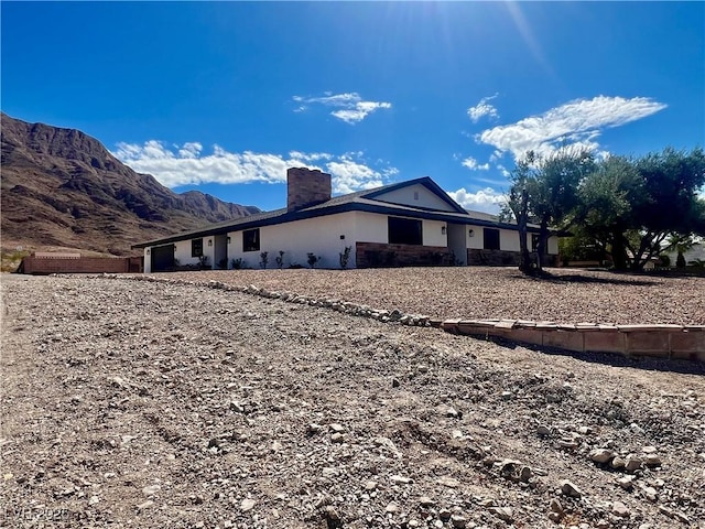 view of home's exterior with a mountain view