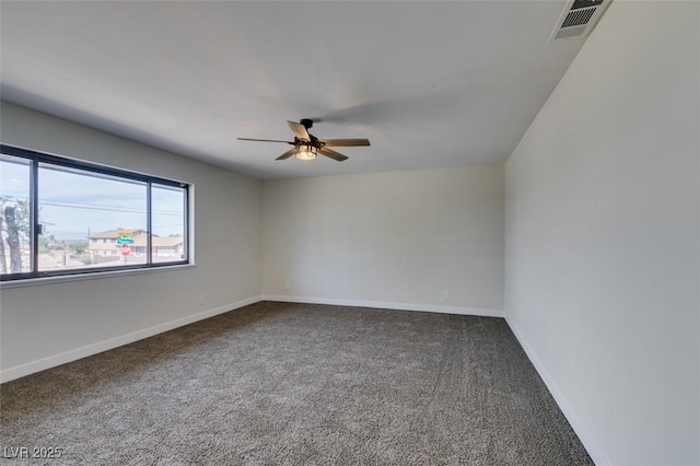 empty room featuring carpet floors and ceiling fan