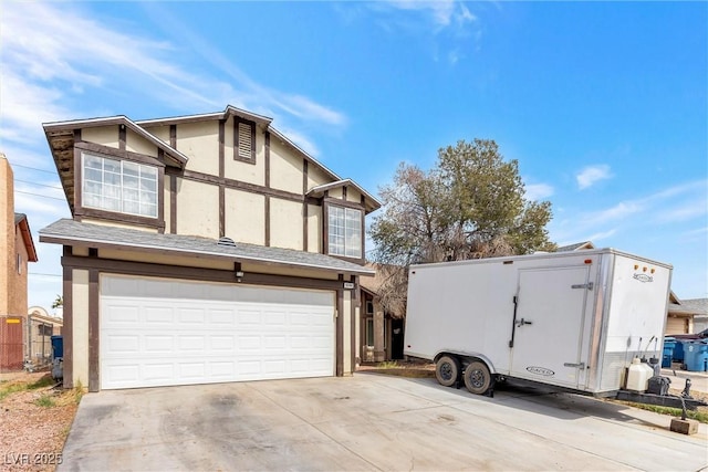 view of property exterior with driveway, a shingled roof, an attached garage, and stucco siding