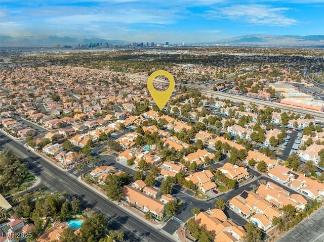 aerial view featuring a mountain view and a residential view