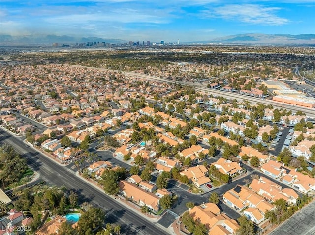 birds eye view of property with a residential view and a mountain view