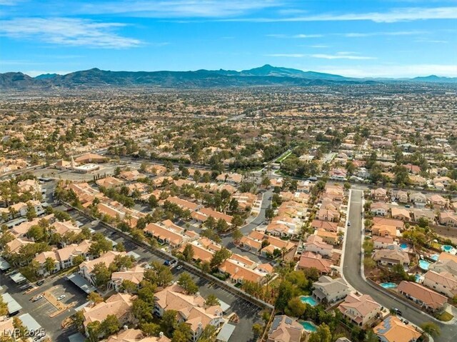 birds eye view of property with a mountain view