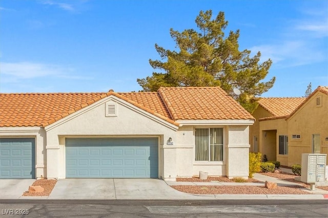 view of front of home with a tiled roof, concrete driveway, an attached garage, and stucco siding