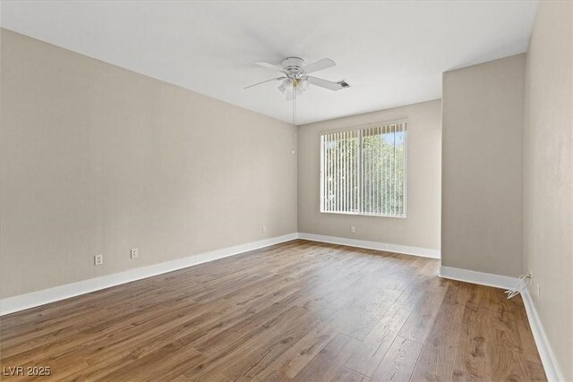 unfurnished room featuring wood-type flooring and ceiling fan