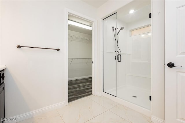 bathroom featuring vanity and an enclosed shower