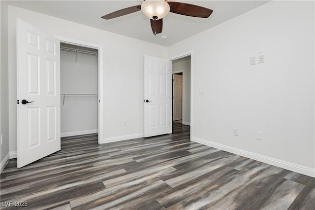 unfurnished bedroom with ceiling fan, dark hardwood / wood-style flooring, and a closet