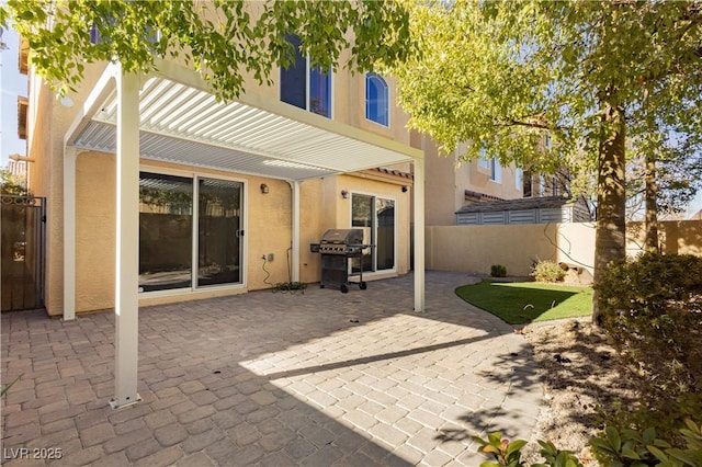 view of patio / terrace with a grill and a pergola