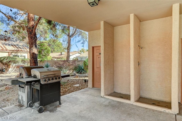 view of patio / terrace featuring fence and grilling area