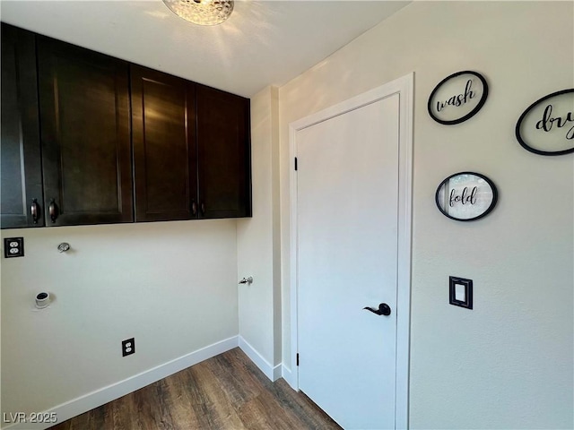 laundry area with cabinets and dark hardwood / wood-style floors