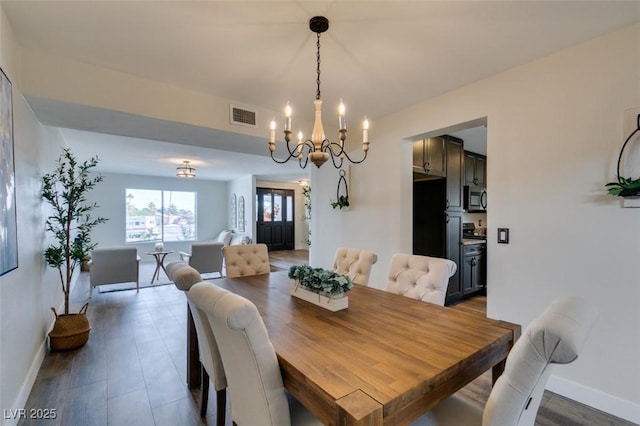 dining space featuring an inviting chandelier