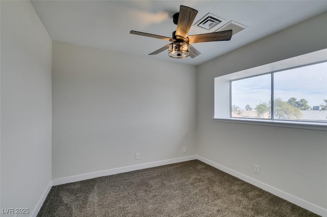 empty room featuring carpet flooring and ceiling fan