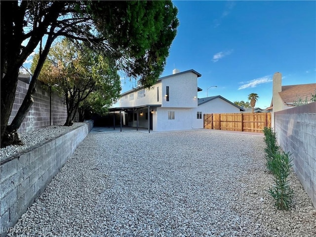 rear view of property featuring a patio area