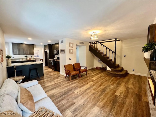 living room with light hardwood / wood-style flooring