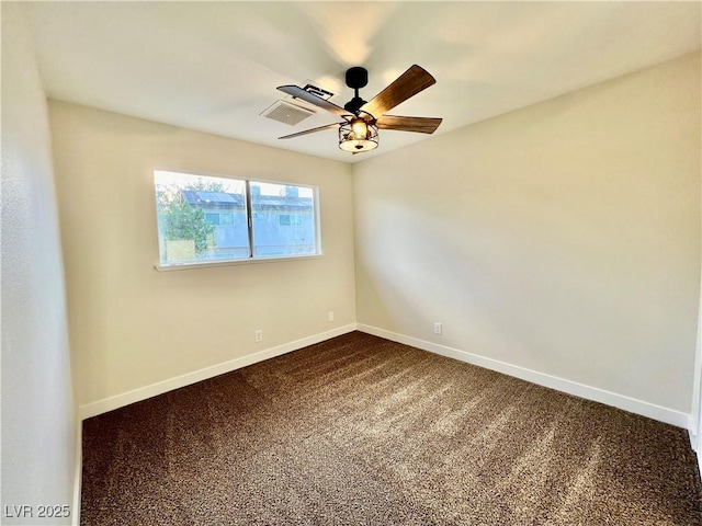 unfurnished room with ceiling fan and carpet