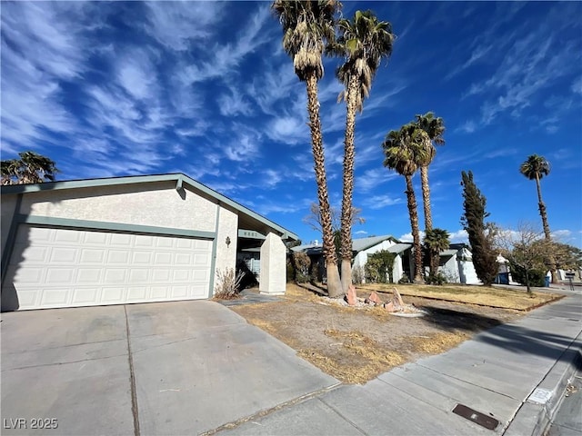 view of side of home with a garage