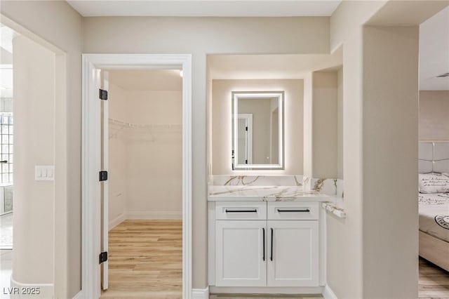 bathroom featuring vanity and wood-type flooring