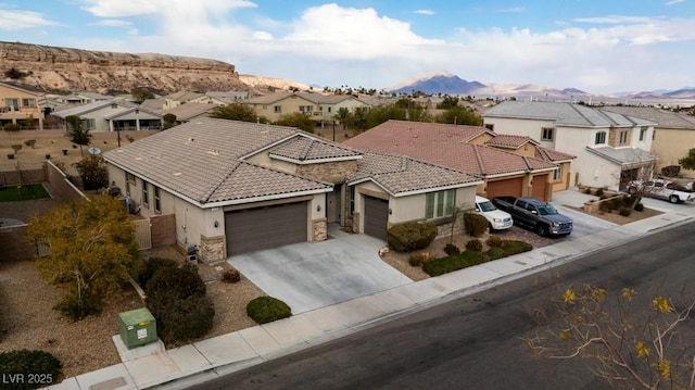 birds eye view of property with a mountain view