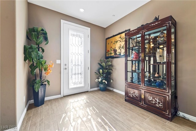 foyer entrance with light hardwood / wood-style floors