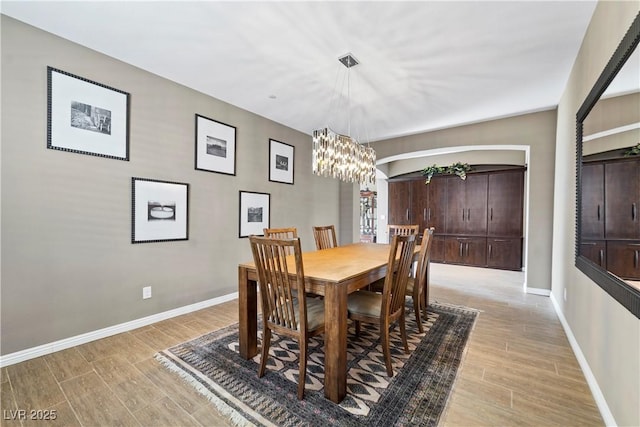 dining area featuring an inviting chandelier