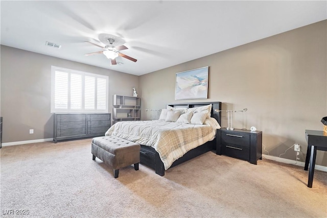 bedroom featuring light colored carpet and ceiling fan