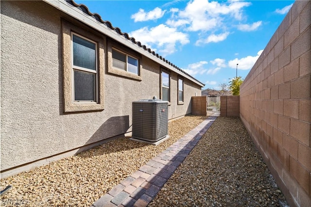 view of home's exterior with central AC