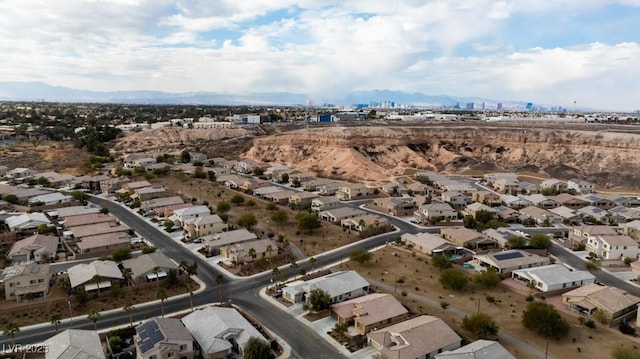 birds eye view of property featuring a mountain view