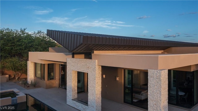 rear view of house with a patio