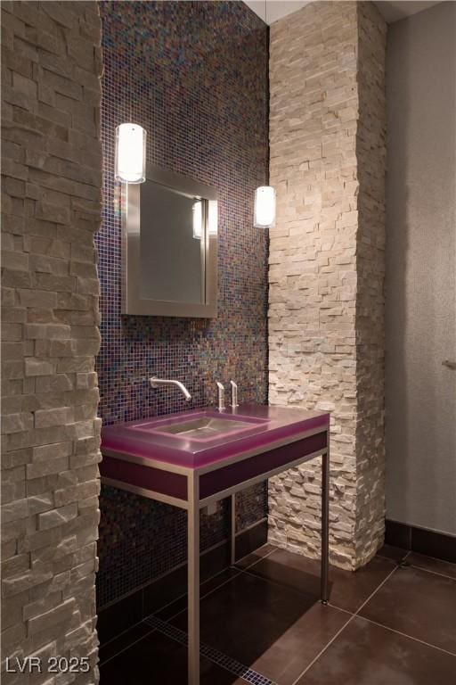 bathroom with tile patterned flooring and sink