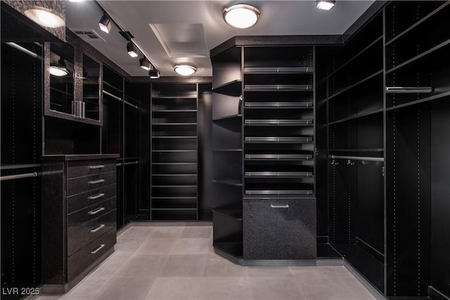 spacious closet with tile patterned flooring