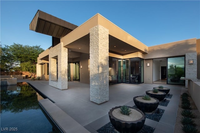 rear view of house with a patio