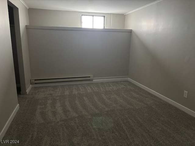 carpeted empty room featuring crown molding and a baseboard radiator