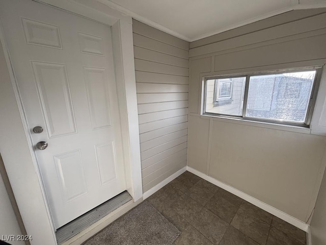 interior space featuring wood walls