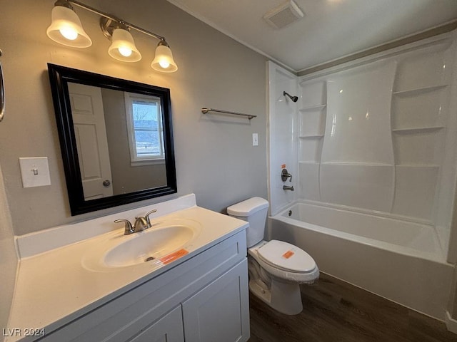 full bathroom with vanity, hardwood / wood-style floors, tub / shower combination, and toilet