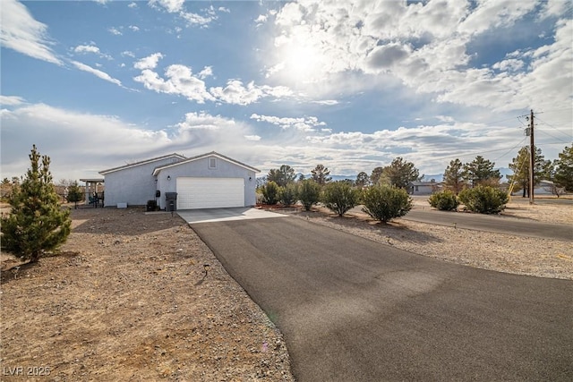 single story home featuring a garage