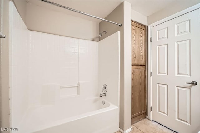 bathroom with tub / shower combination and tile patterned flooring