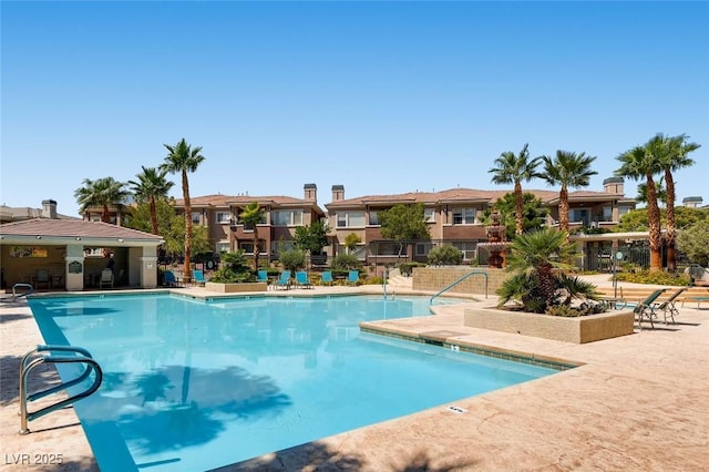 view of swimming pool with a patio area