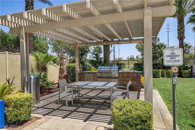 view of patio featuring a pergola, grilling area, and exterior kitchen