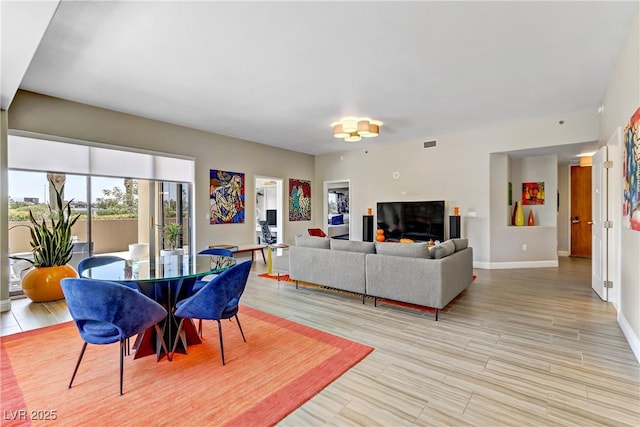 living room with light hardwood / wood-style floors