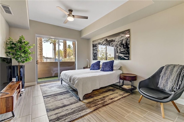 bedroom featuring ceiling fan and access to exterior