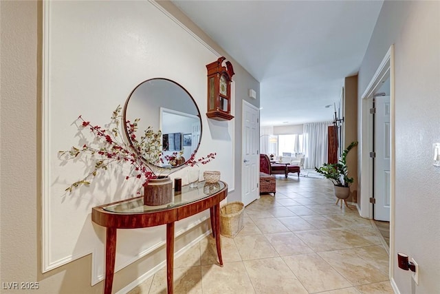 corridor featuring light tile patterned floors