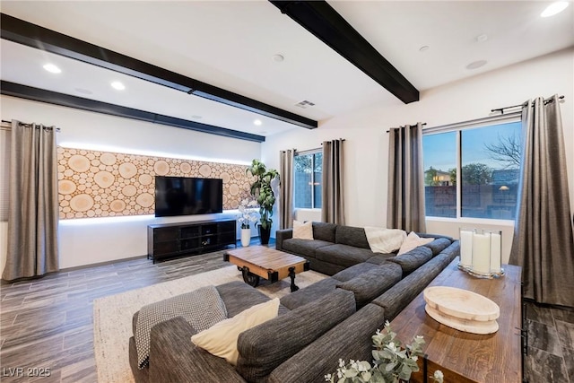 living room featuring beam ceiling and hardwood / wood-style floors