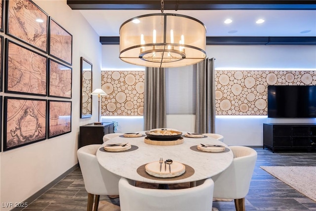 dining area with dark wood-type flooring and an inviting chandelier