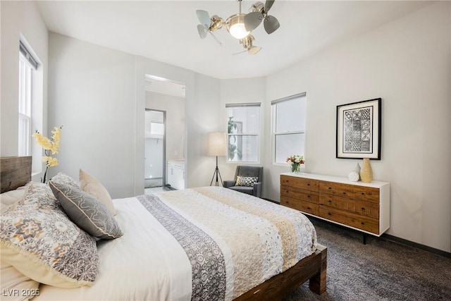 bedroom featuring ceiling fan, ensuite bath, and carpet flooring