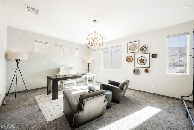 carpeted living room featuring a chandelier