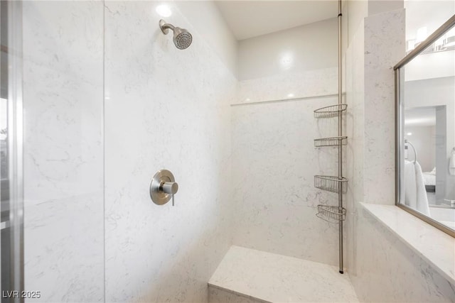 bathroom with a tile shower