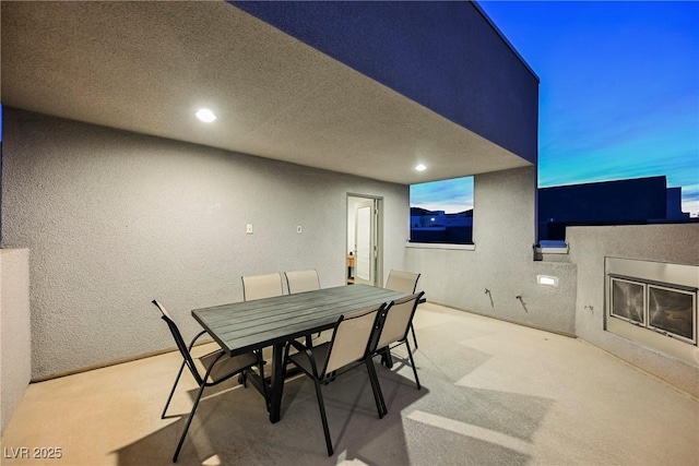 view of patio terrace at dusk